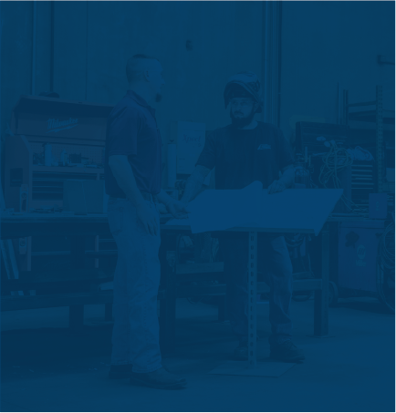 Sheet metal apprentice receiving training